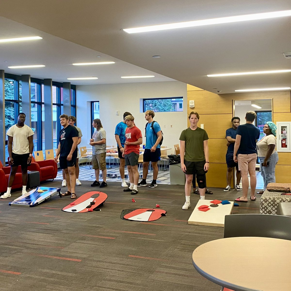 LivingAtMSUM's tweet photo. RAs met &amp; played beanbags with our early arriving Football Team tonight! #dragonslivehere @msum_football https://t.co/0BQekbfUTI