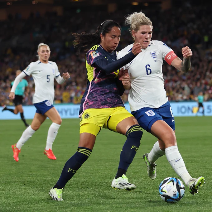 Millie Bright battles for the ball