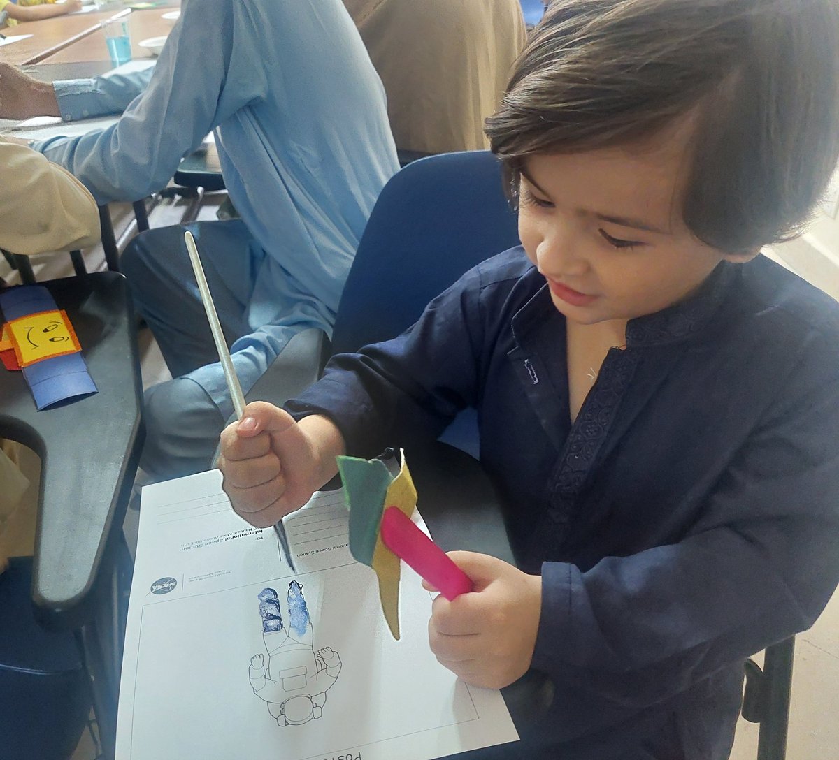 mariamibkhan's tweet photo. Painting in an astronaut...difficult to pick one favourite but he was adorable...and he did not let go of that spaceship prop...until he washed it with water because it fell on the floor and he said it got germs on it. https://t.co/IED1h8iAWa