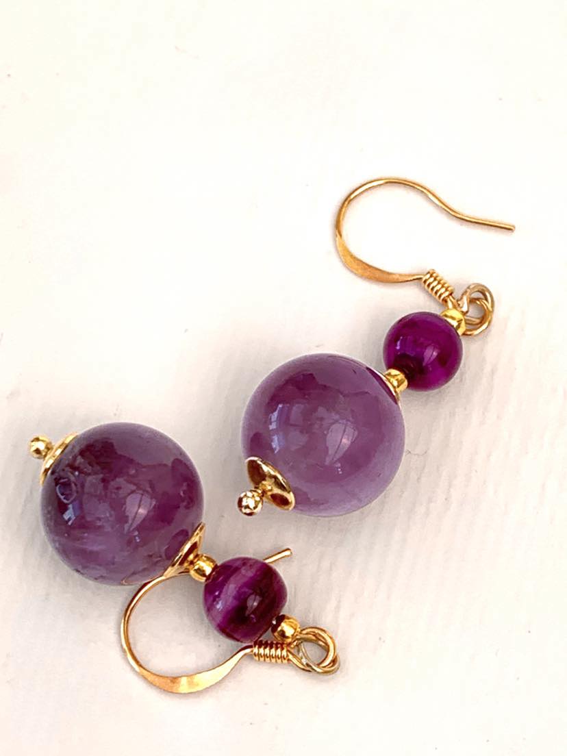 The centrepiece of these earrings are dream amethyst agate gemstones, complemented with smaller purple agate pieces.

#MadeinWales #handmadeearrings #gemstoneearrings #agateearrings #PurpleEarrings #gemstonejewellery