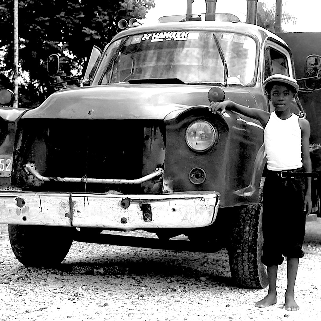 When Albert Minott was 7 he ran away from home to avoid a beating by hiding in the back of truck. <a href="/jollyboysmusic/">Jolly Boys</a>