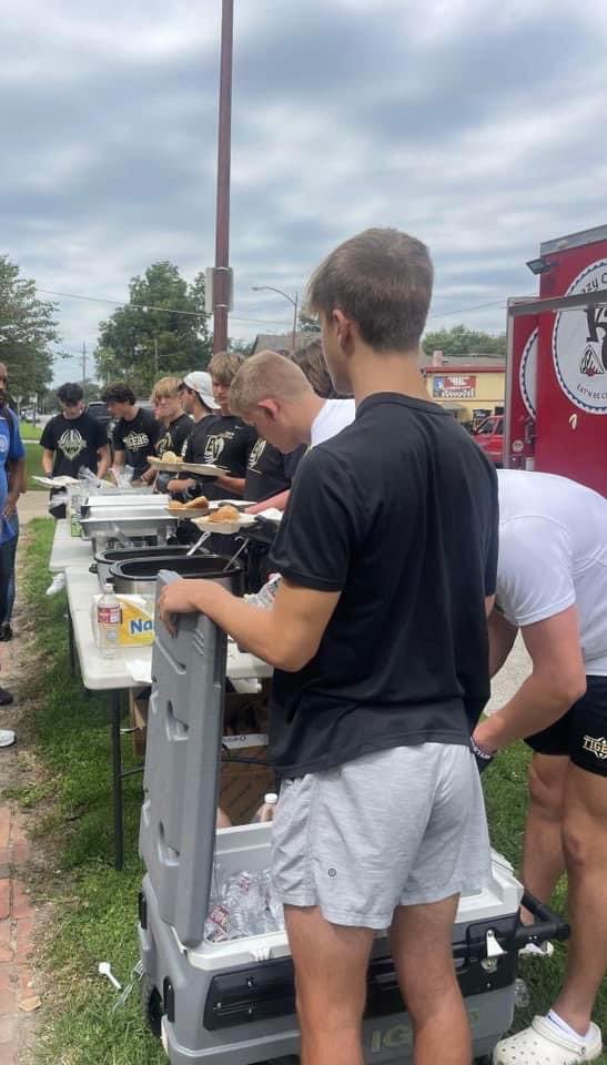 Me and the boys serving up some BBQ at an outreach ministry for over 100 folks in need.  #BVTigersSeniorsServe