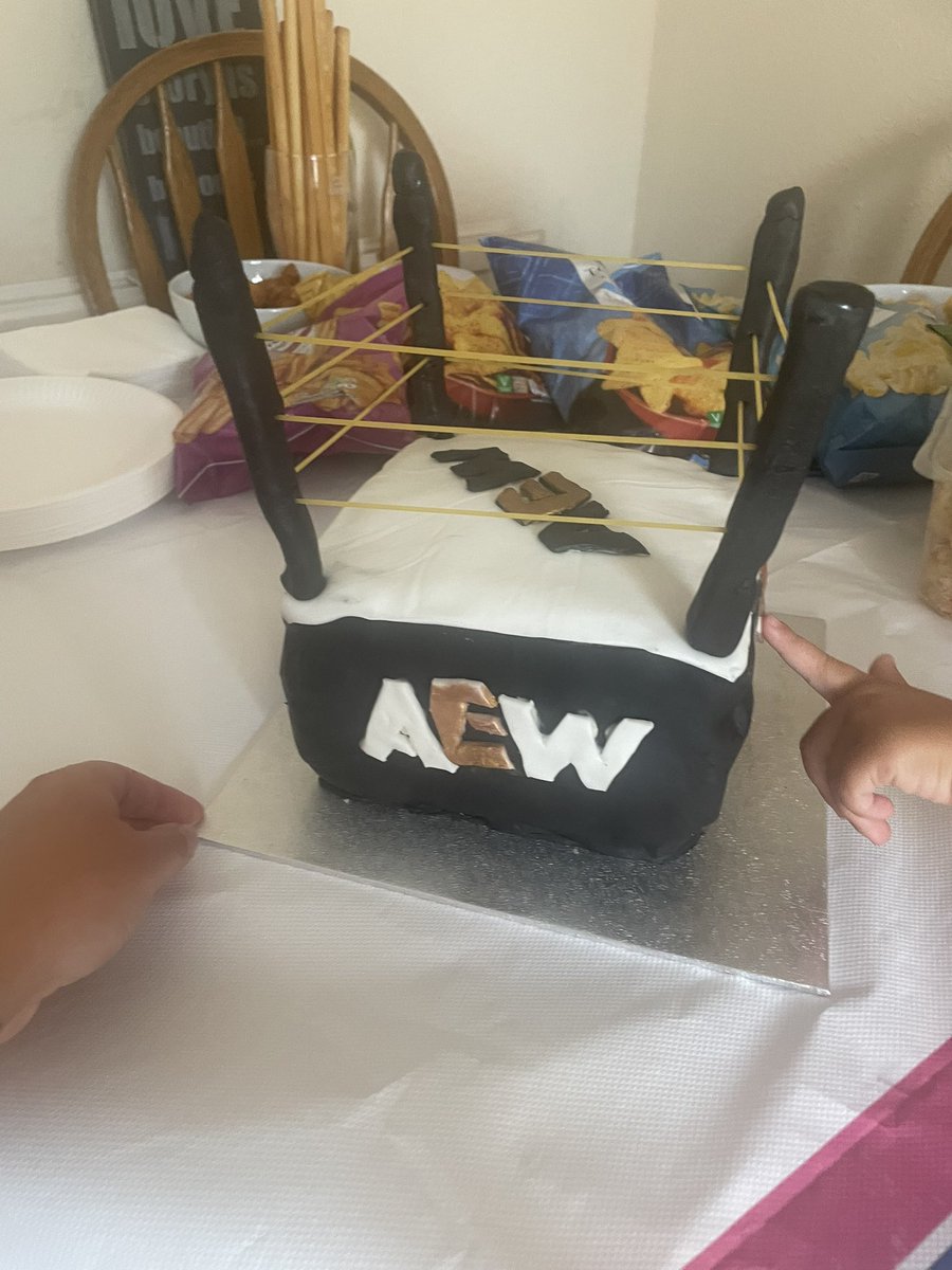MrsEAAdams's tweet photo. My 7 year old asked for a wrestling ring cake, only one ring it could be! Can’t wait for #AEWAllIn ❤️ #AEW #AEWDynamite #AEWCollision https://t.co/mfzBDICouK