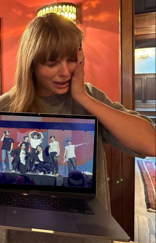 cosmicblair's tweet photo. a rare photo of taylor swift crying to enhypen's song shout out https://t.co/bsNRhjWybP