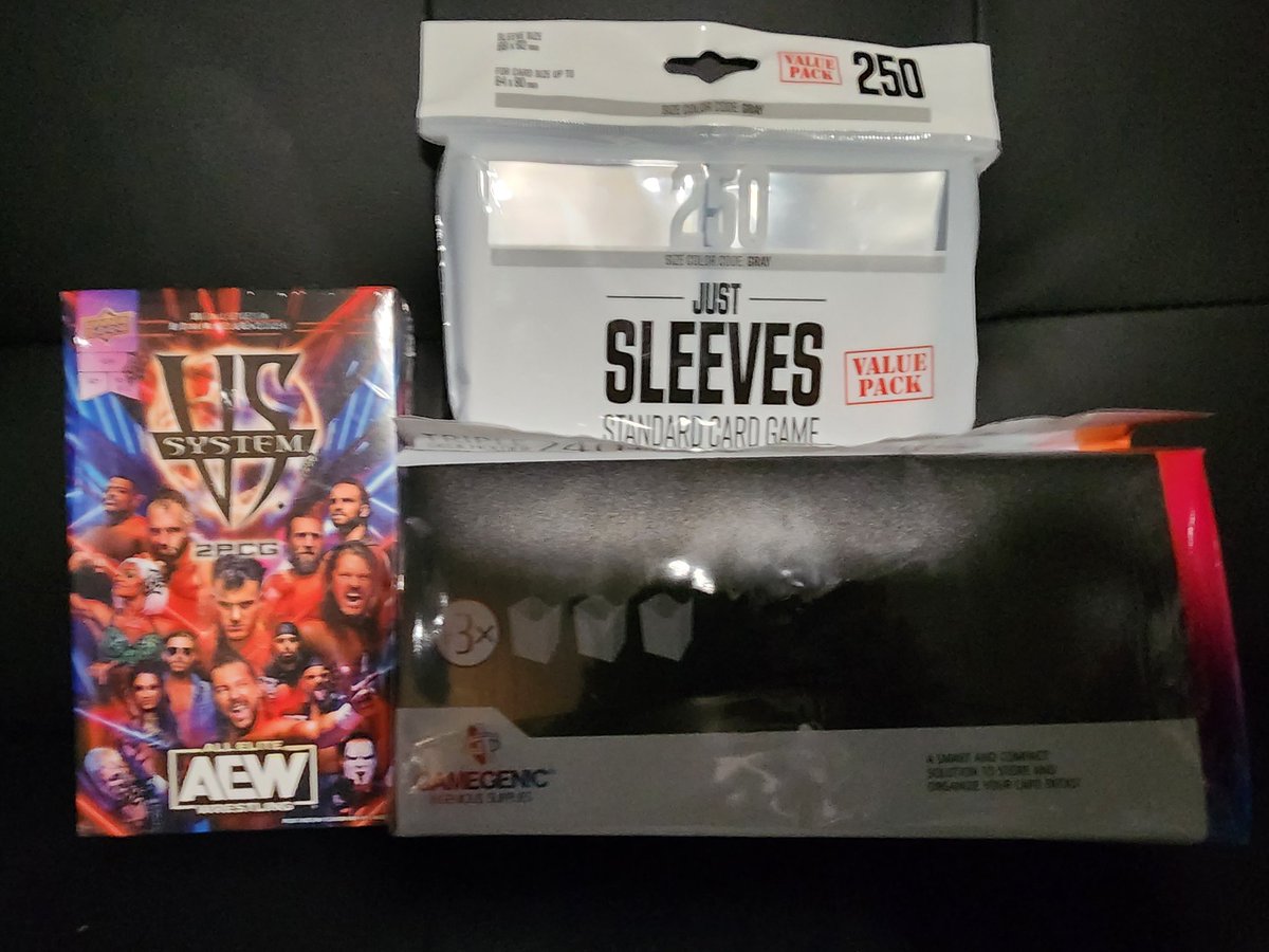 drscottkelly's tweet photo. Sleeving is sometimes more relaxing than actual games. Lol (Everything just arrived. I knew sleeved cards wouldn't fit back in the original box, so I got a large plastic deck box too.) #AEW #VsSystem #UpperDeck https://t.co/7cHfRCwGlV