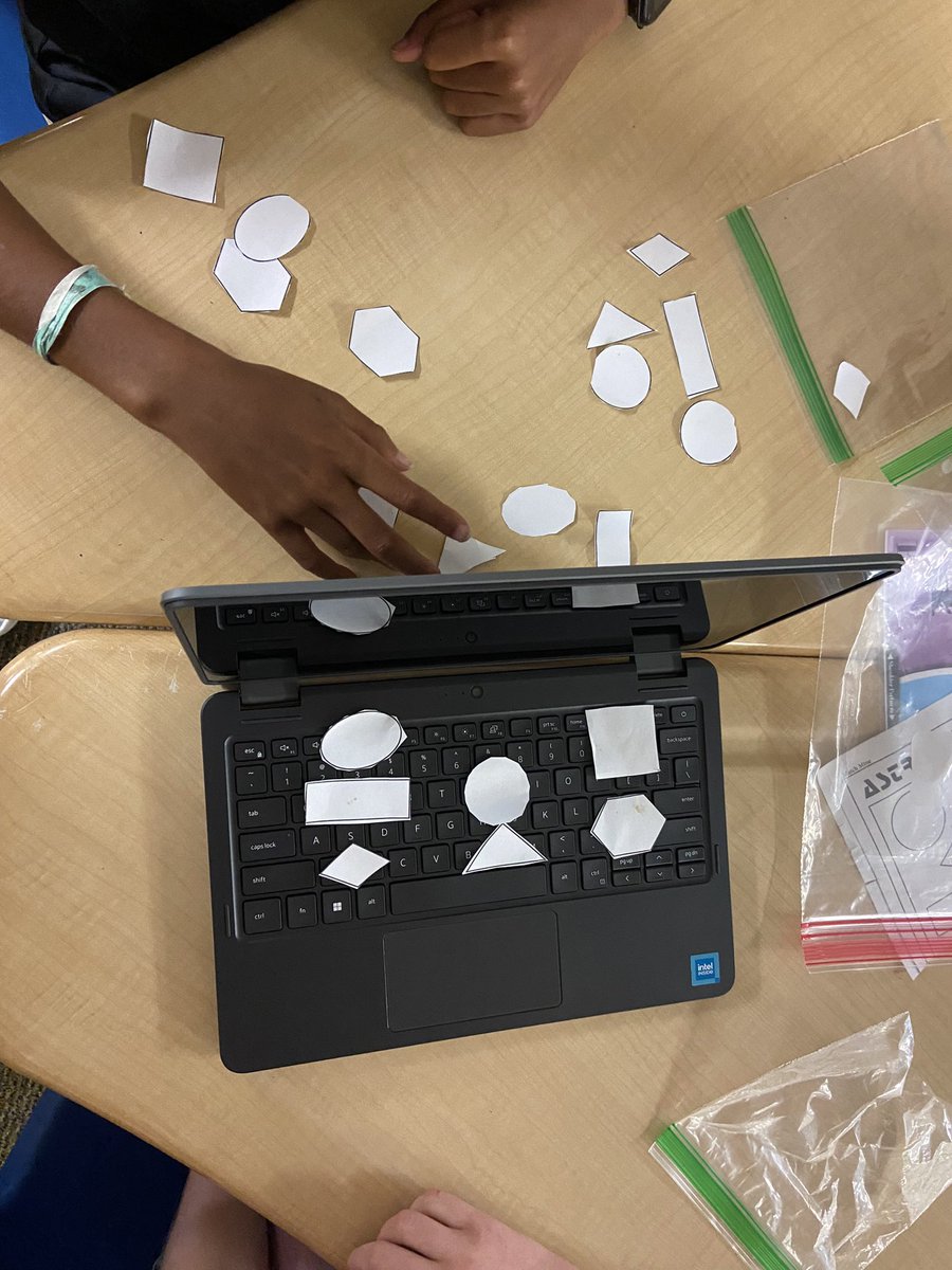 Mr. Greenstein’s students are building class connections by playing a game. One student created a design hidden by a computer and had to describe in detail the shapes so the other student could recreate it.<a href="/QHESPasco/">Quail Hollow Elem</a>  <a href="/ngrahamjr/">Norman Graham Jr</a>