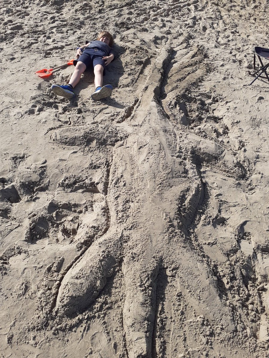 DarrenBernstein's tweet photo. Toby recreating @Dean_R_Lomax in Lyme Regis. Attenborougsaurus conibeari (he tells me!) https://t.co/lIEttzxolB