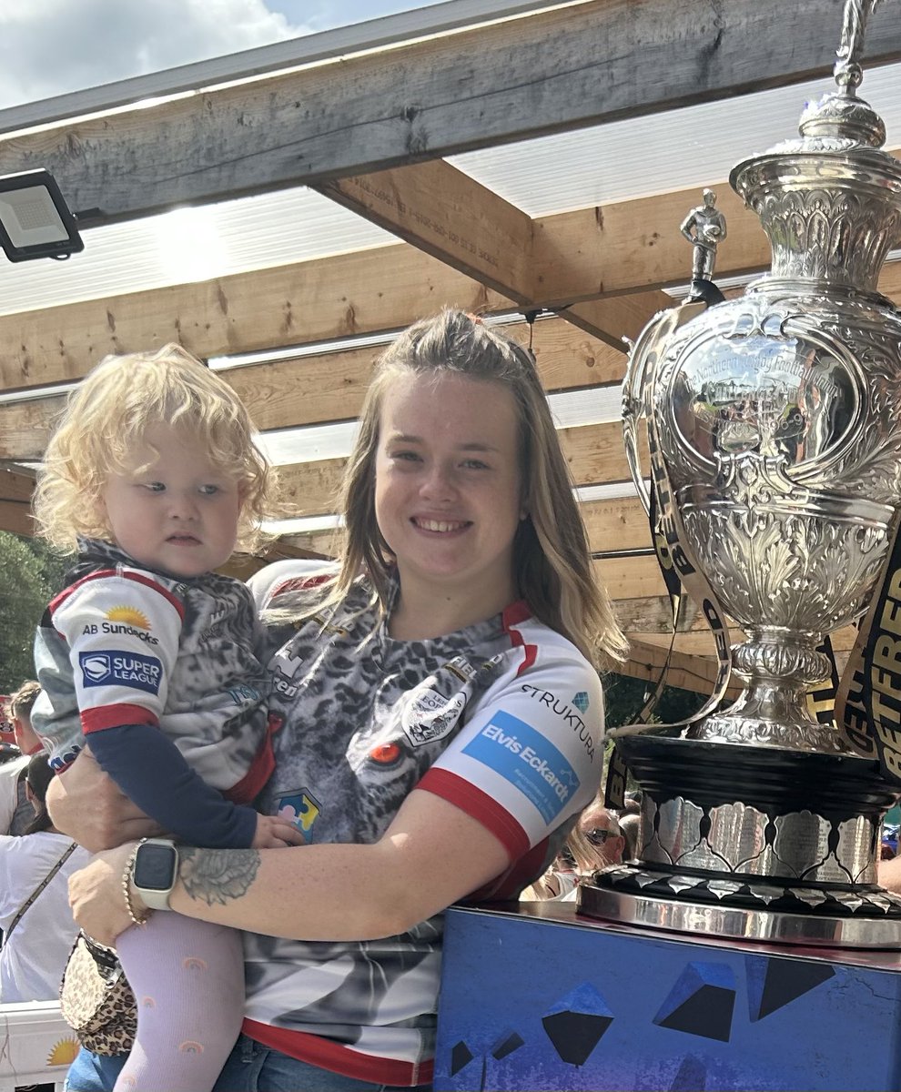 KimSlac92604278's tweet photo. It’s been 52 years since @LeighLeopardsRL last won this trophy and here I am all excited to have a photo with it just for my child to look at it like it’s just stolen her last chocolate 🙃 https://t.co/YmK64spLX8