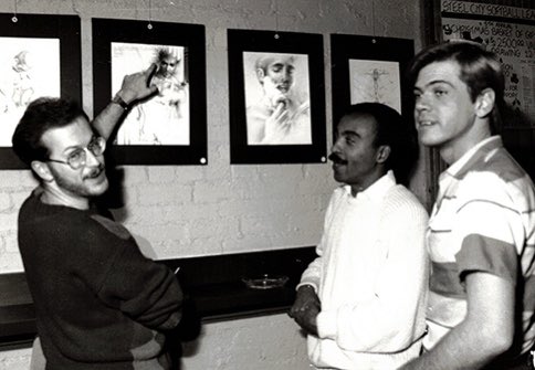 From the Archives: Joe, Don, and Art admire Jon Crawford's drawings on display at Auntie Mame's (later known as Images), donated by the artist to benefit the Frank Borrelli Memorial AIDS Fund. We’re queer. We’ve been here. More about our archives: qburgh.com/qarchives