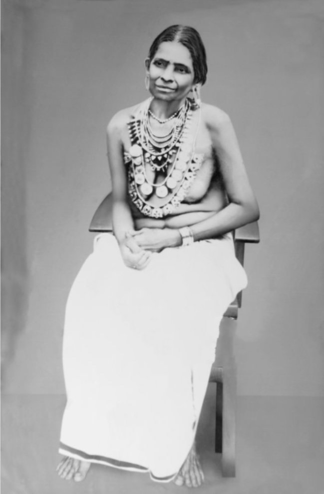 Photo 1 : of Upper Caste woman walking without upper garment. This photo is taken in 1990s.

Photo 2...
