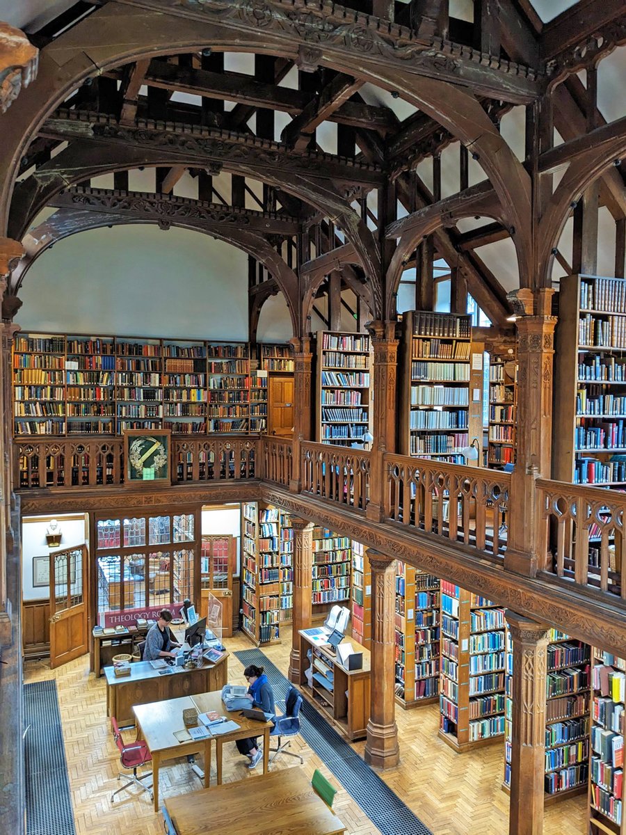 A view of the Theology Room from the upper gallery, taking in the ground floor, bookshelves and the vestibule into the history room
