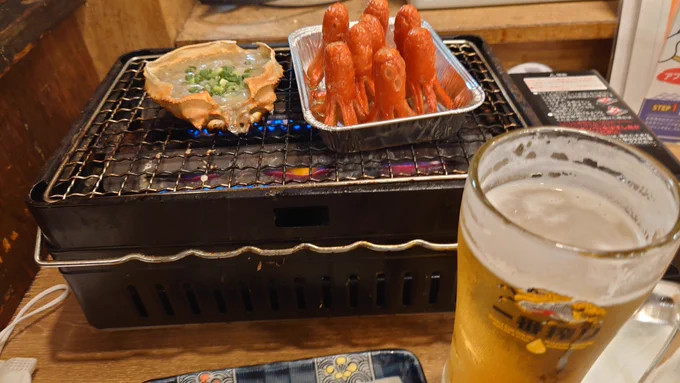 (=゜ω゜)タコさんウインナーが網の上で焼かれるのを肴にビールのんでる