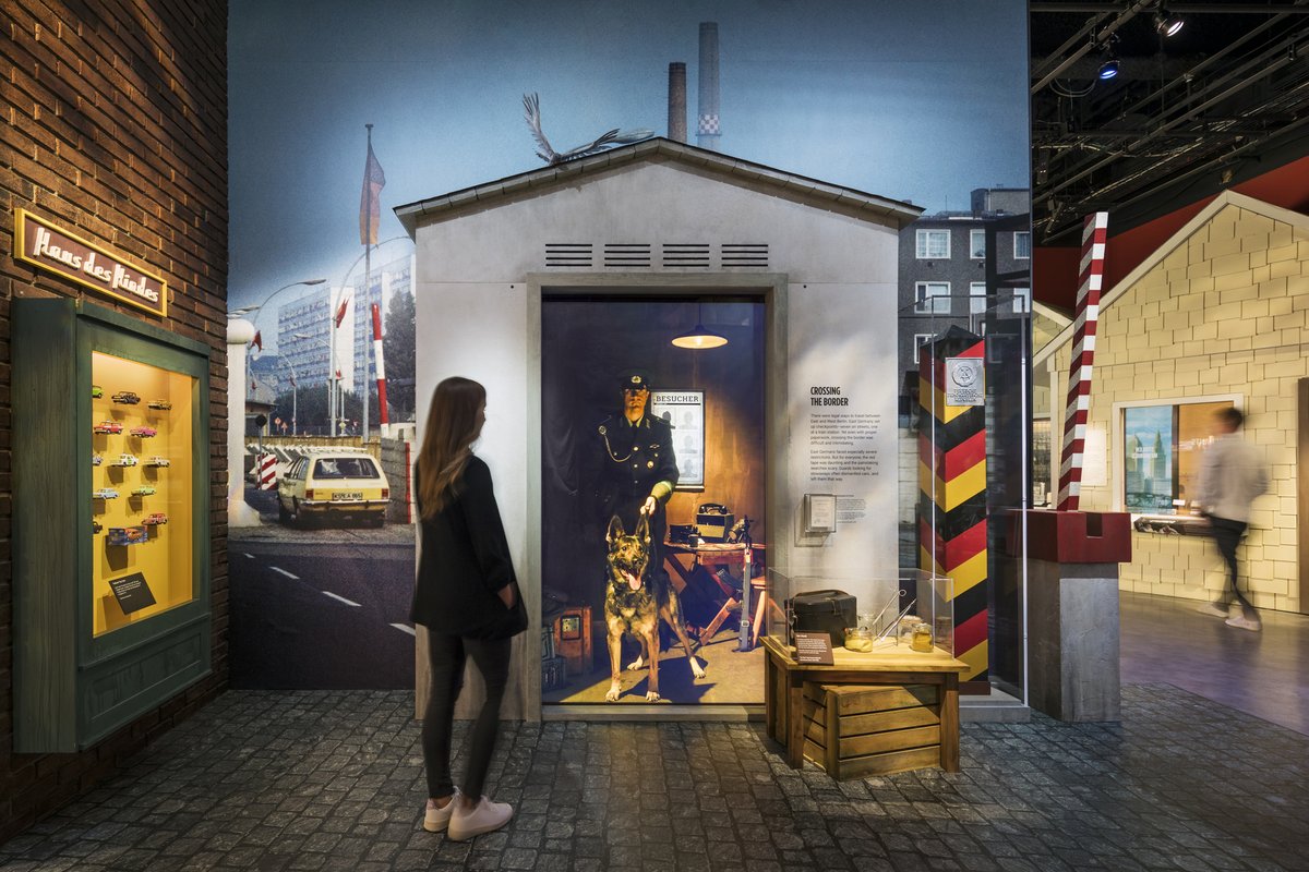 IntlSpyMuseum's tweet photo. Today in #SpyHistory: East Germany began construction on the Berlin Wall, 1961. Explore SPY's exhibit Berlin, City of Spies—a recreation contrasting West and East Berlin during the Cold War. View two original pieces of the #BerlinWall (pictured) on display https://t.co/ng46be4ixK https://t.co/1JpSm7m9b3