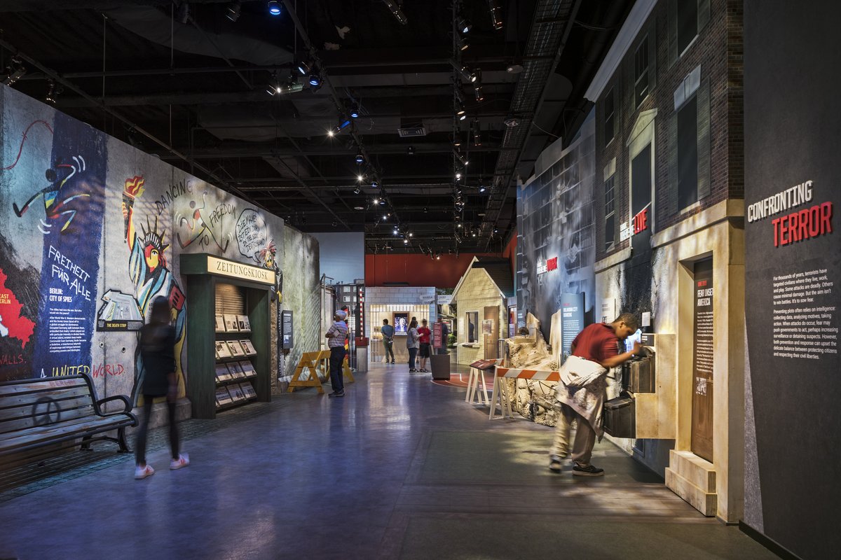 IntlSpyMuseum's tweet photo. Today in #SpyHistory: East Germany began construction on the Berlin Wall, 1961. Explore SPY's exhibit Berlin, City of Spies—a recreation contrasting West and East Berlin during the Cold War. View two original pieces of the #BerlinWall (pictured) on display https://t.co/ng46be4ixK https://t.co/1JpSm7m9b3