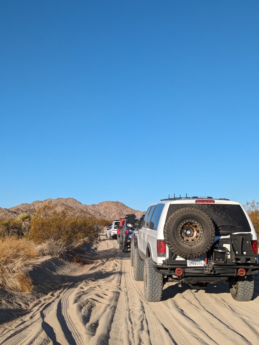 wattreach's tweet photo. one of these things is not like the other, and it ain't the R1S ⚡!

This Mazda was stuck for 45 minutes, because he shouldn't have been here.

#jtree #joshuatree https://t.co/8pCqWQBIwA
