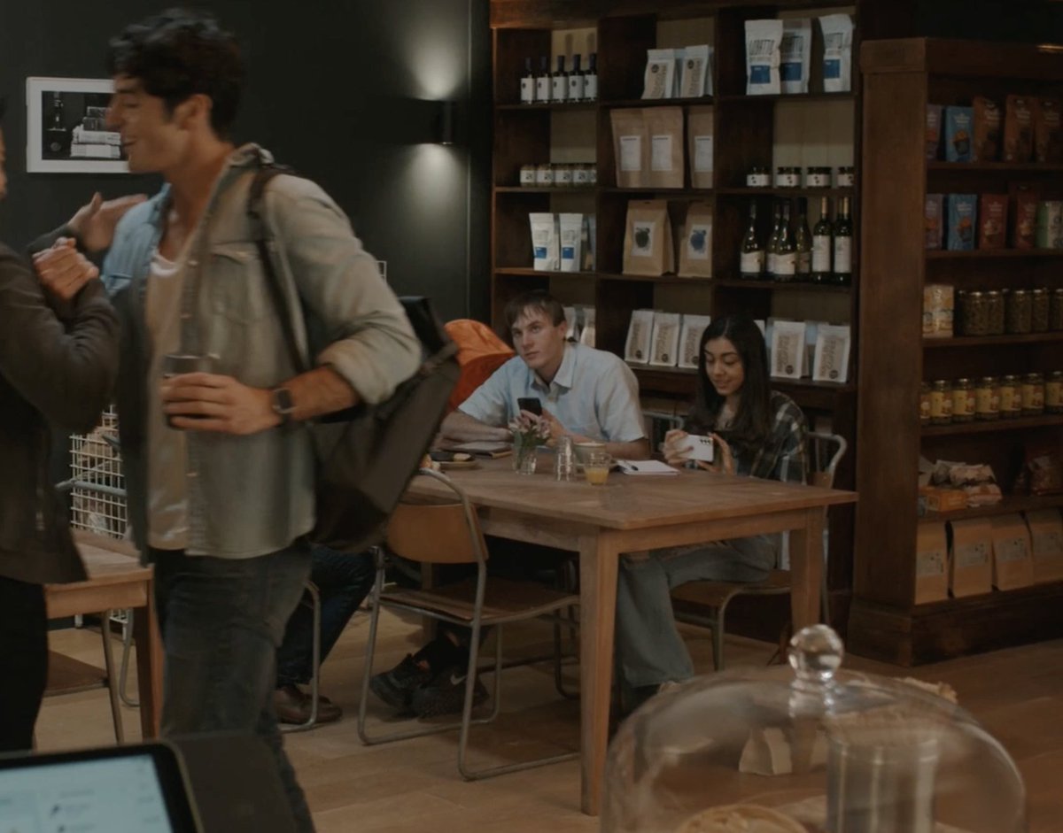 help i never noticed the girl in the cafe trying to sneak a pic of alex (cropped so no one has to look at miguel's face)