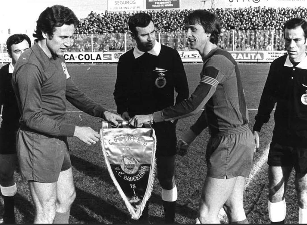 Getafe's Javier Asunción Alfonso and Barcelona's Johan Cruyff meet before the kick off of their Copa del Rey match.  18 January , 1978
