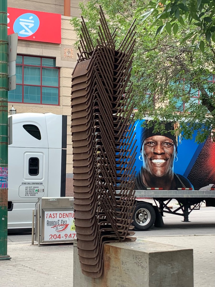 moore_oliver's tweet photo. It’s hard to imagine a much better metaphor for Canada’s approach to public space than commissioning an art piece of a pile of unusable chairs https://t.co/0cXT0vw5iK