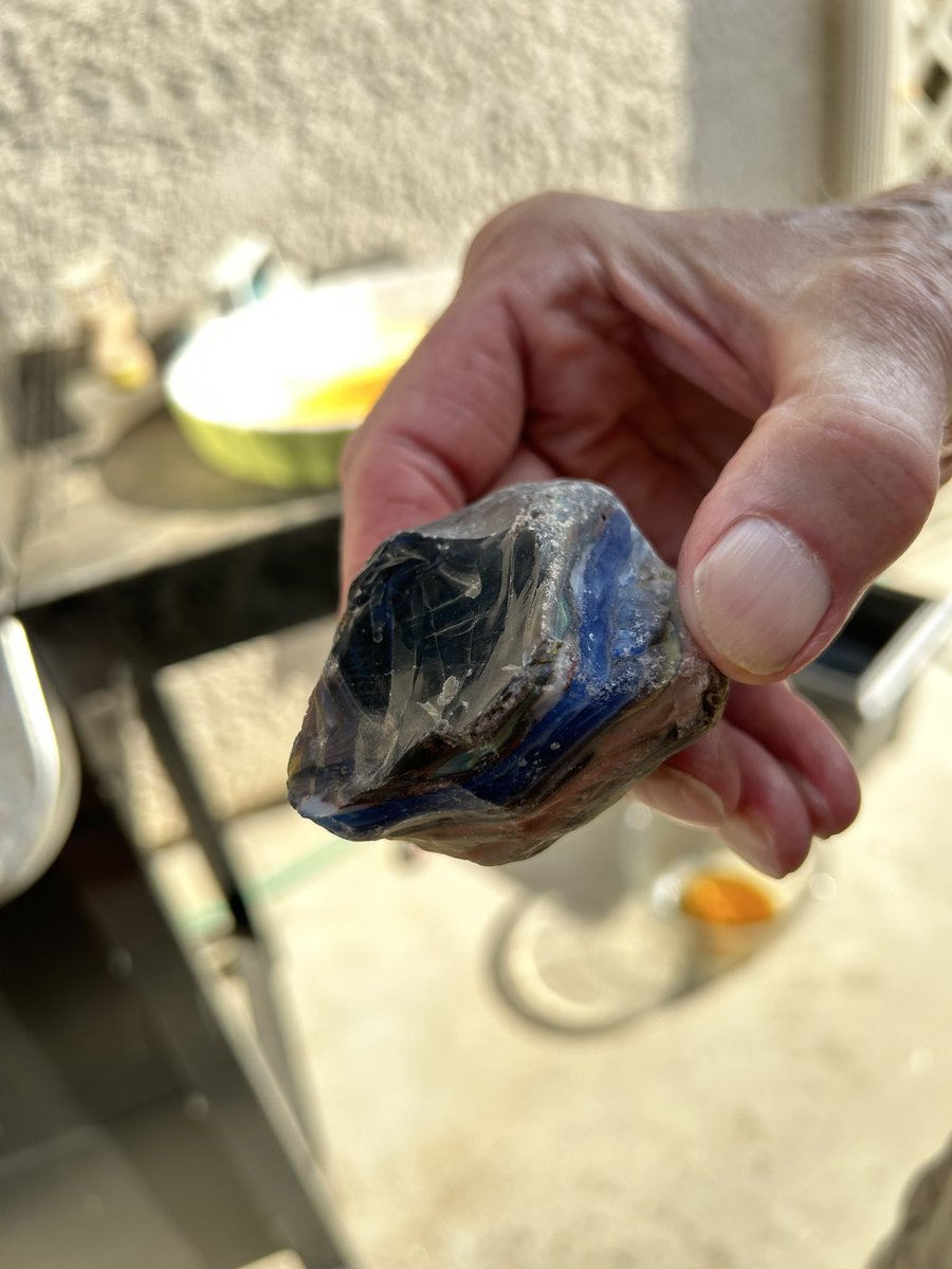erinbowbooks's tweet photo. Hey geology Twitter — this is in my parents garden in California.   Is it a rock or some kind of #fordite like industrial product?   Heavy, glassy, very hard. https://t.co/0dUEsROiHG