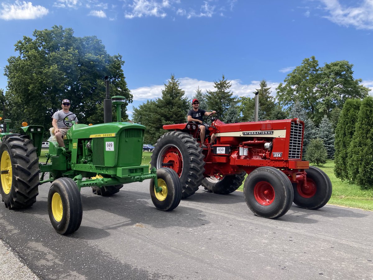 DHueni's tweet photo. Riding along side the soon to be brother in law at the Shifting Gears tractor parade! #AndyClean had us looking sharp with the freshly restored old timers https://t.co/ZQYoRsveR2