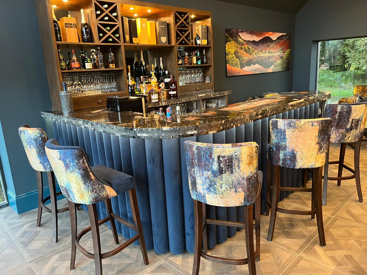 Dawnvale's tweet photo. This home bar is a showstopper!

From the illuminated walnut back bar to the plush indigo velvet column bar frontage, every part of this bar is sure to impress guests.

We worked closely with the customer to craft this bespoke home bar that combines beauty and functionality. https://t.co/mzd9kmtAbs