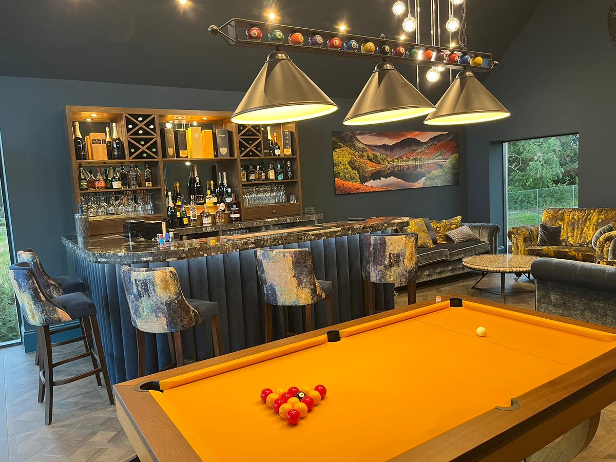 Dawnvale's tweet photo. This home bar is a showstopper!

From the illuminated walnut back bar to the plush indigo velvet column bar frontage, every part of this bar is sure to impress guests.

We worked closely with the customer to craft this bespoke home bar that combines beauty and functionality. https://t.co/mzd9kmtAbs