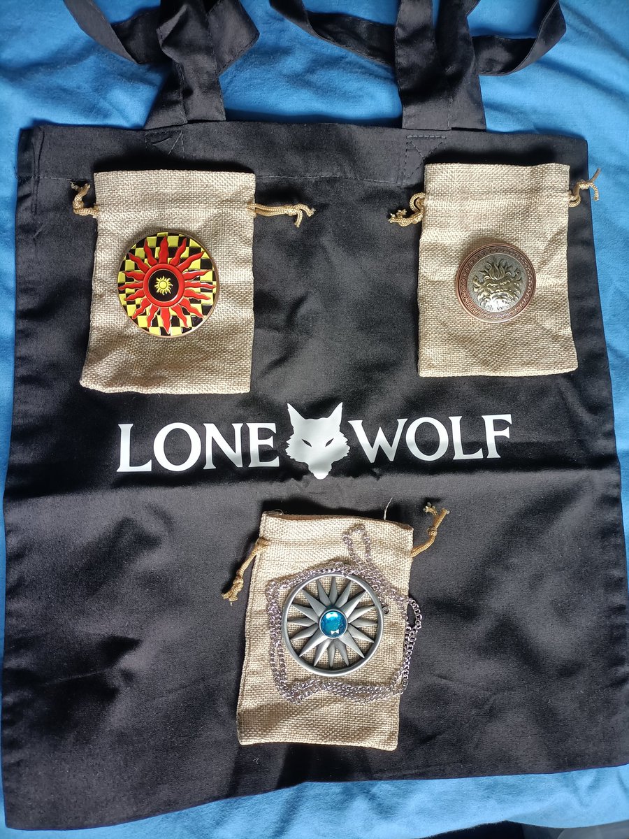 kaisnowshadow's tweet photo. #RPGaDAY2023 favourite convention purchase. Had the honour of helping Rene' Batsford run the Lone Wolf stall at Dragonmeet '22.  A genuine Crystal Star Pendant (Magician not included), a Kai Cloak Clasp and a Kai Master's badge of rank. 
Purchase here: https://t.co/S65mP3lvN4 https://t.co/lnld8Pu3uU