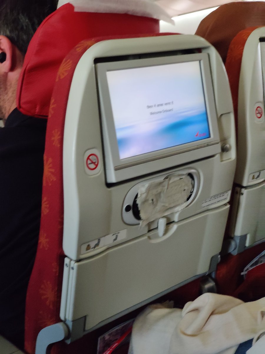 AshJPe's tweet photo. The sorry state of @airindia flight from Goa to London. None of the "entertainment" systems worked and the air hostess would provide magazines when asked why the system is not working. Not their fault, maybe @TCS @TataCompanies @RNTata2000 can have a closer look https://t.co/cGLBIfiDvX