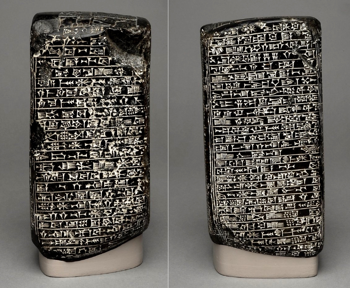 Irregular rectangular-sided monument recording Esarhaddon's restoration of Babylon; possibly black basalt; carved symbols on the upper surface. Cultures/periods: Neo-Assyrian, c. 670 BC. Excavated/Findspot: Babylon. Collection: British Museum.