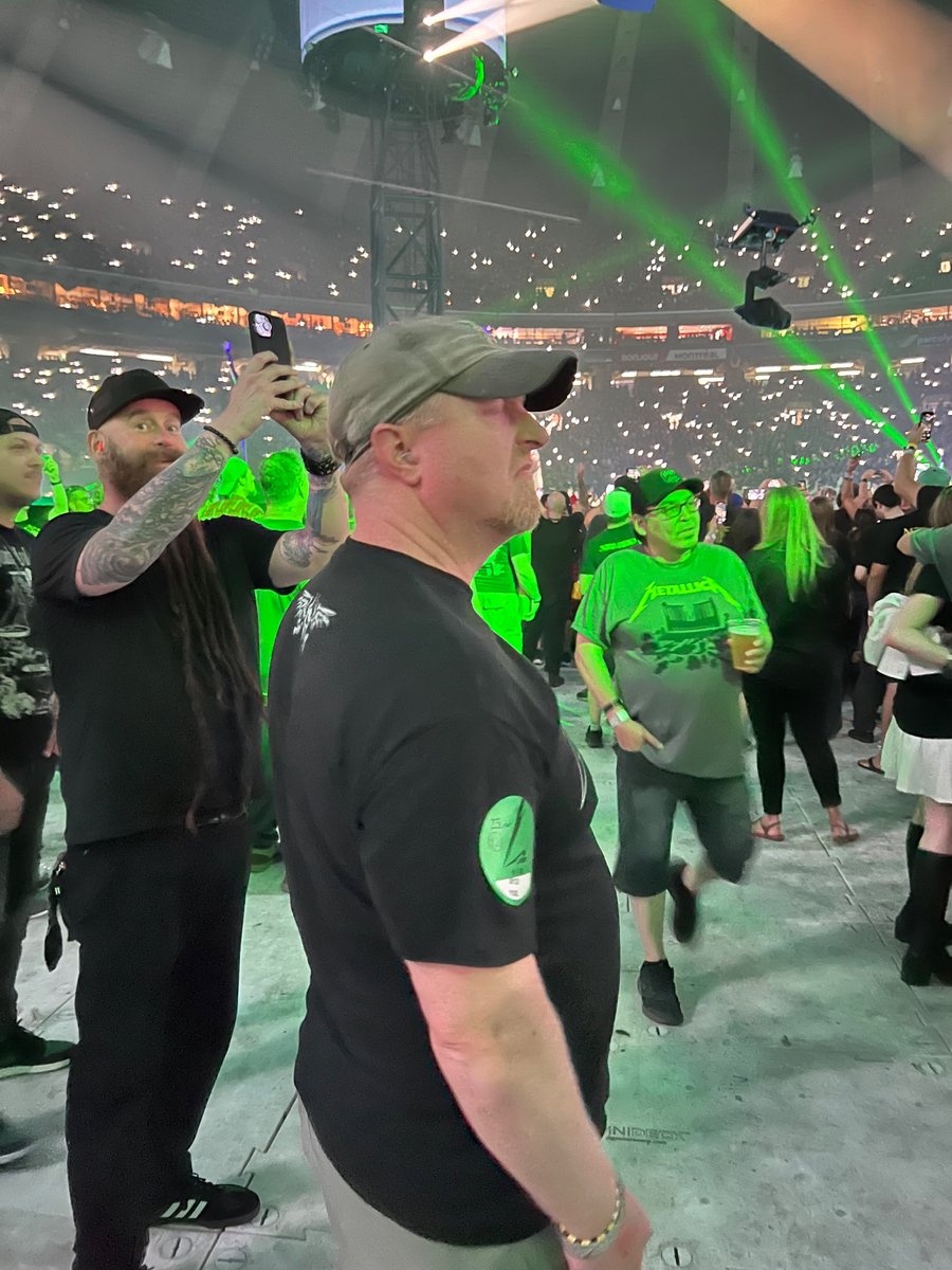 Jennkrem0139's tweet photo. My friend at Metallica concert with my favorite bassist over his shoulder @5FDPChrisKael. Now my friend understands how cool @5FDPChrisKael is. #ShitYesSon π€π€ https://t.co/mH0ZT6KI0W