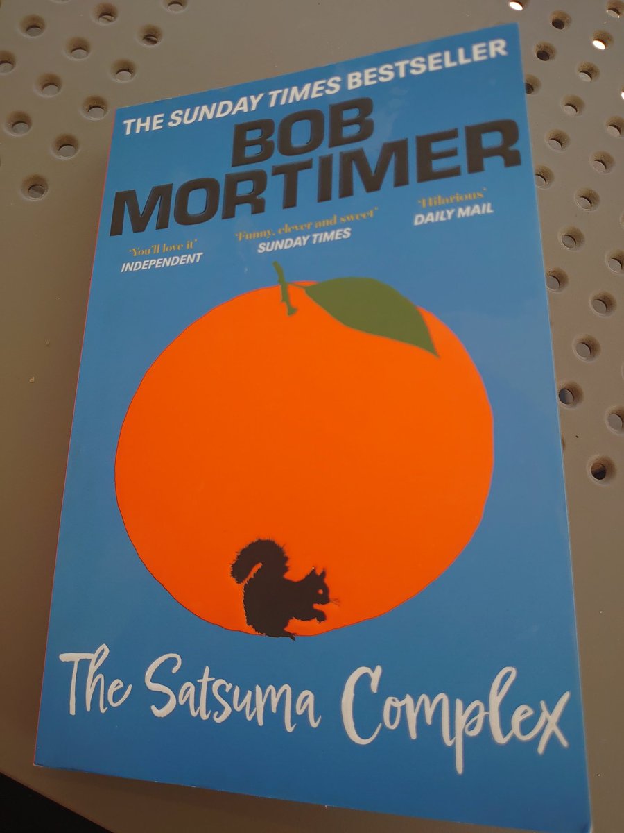 Really enjoying this year's holiday read thank you <a href="/RealBobMortimer/">bob mortimer</a>.
Fully expect it to become a telly thing soon with Bob appearing as Clown Shoes in the police station scene.
Excuse the shitty vinyl table in the snap, original photo looked a little poncey with a pool behind it.