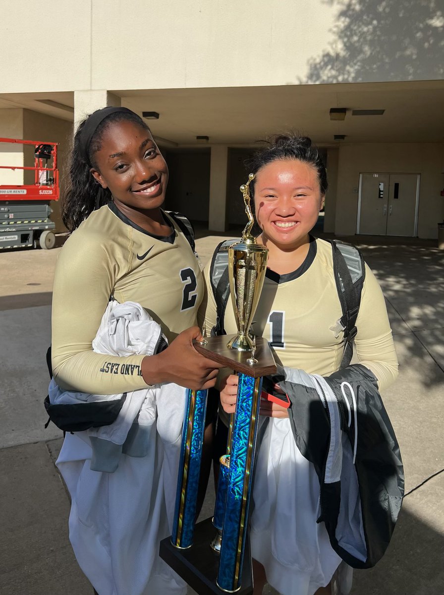 Megan Nguven from 16 National Green and Lolo Lambert from 18 National Green showing off their first place trophy from the Sasche Tournament...Plano East won the tournament!