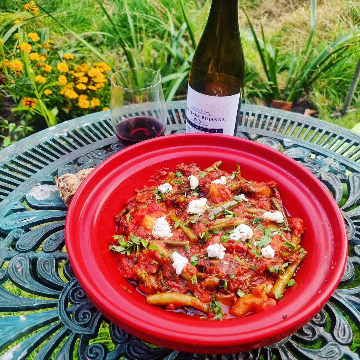 Greek/Middle Eastern beans in tomato sauce - no not, baked beans, but Fasolakia Lathera, fine and dwarf green beans cooked and slathered in olive oil till they squeak when you bite them. Potatoes, cumin, parsley, and pepper, as well as Feta to finish.