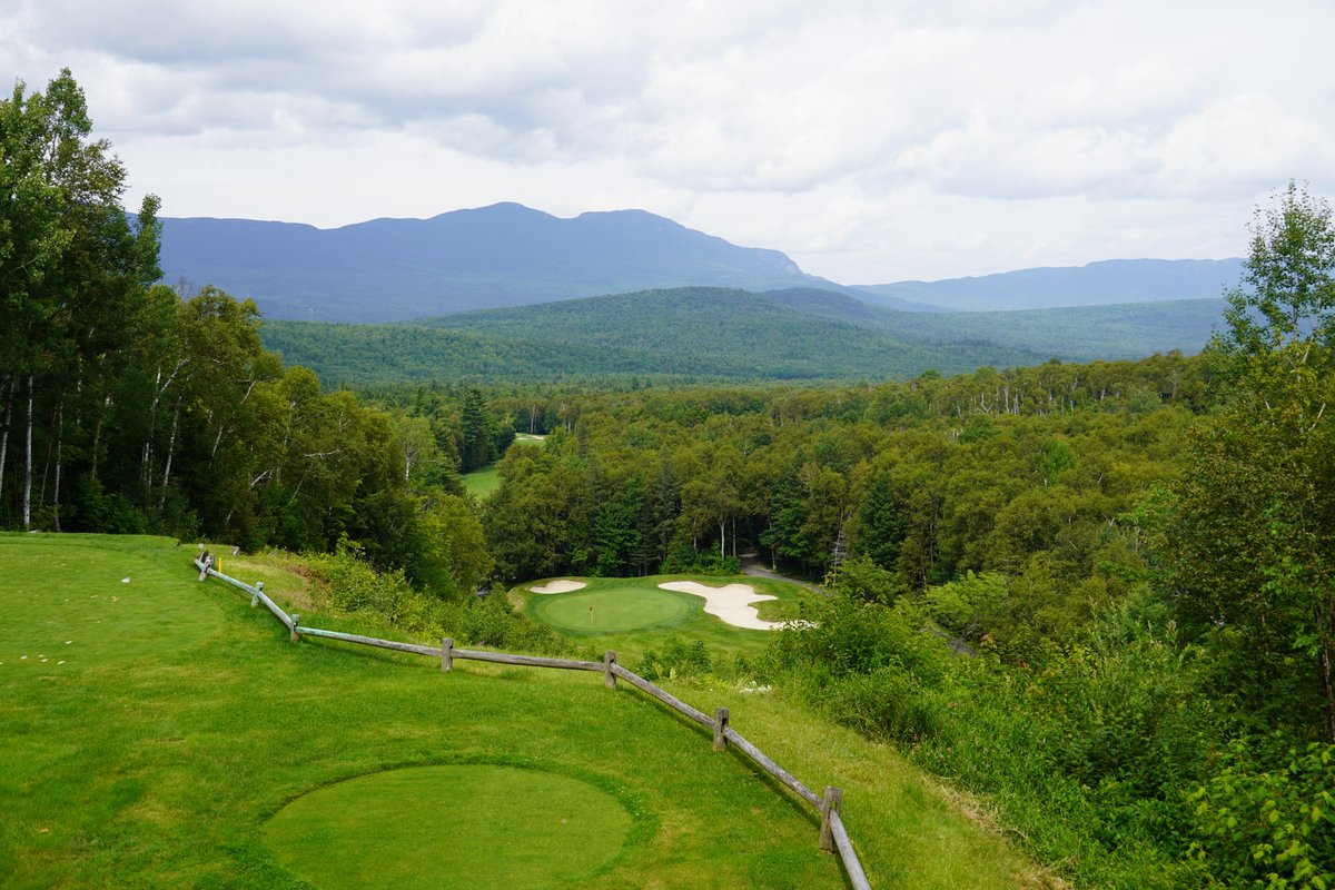 Hole 11: “Precipice” Known as Sugarloaf’s most famous hole, this par 3 drops more than 120 feet from the tee and plays nearly two clubs downhill to a green surrounded by bunkers and the Carrabassett River. @BushnellGolf | #ByTheNumbers | #CocaColaSugarloaf