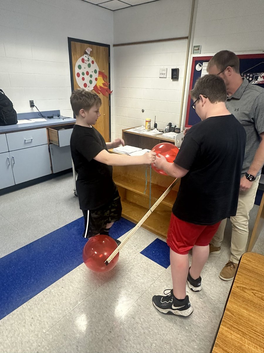 Does air have weight? 5th grade is working hard to find out!