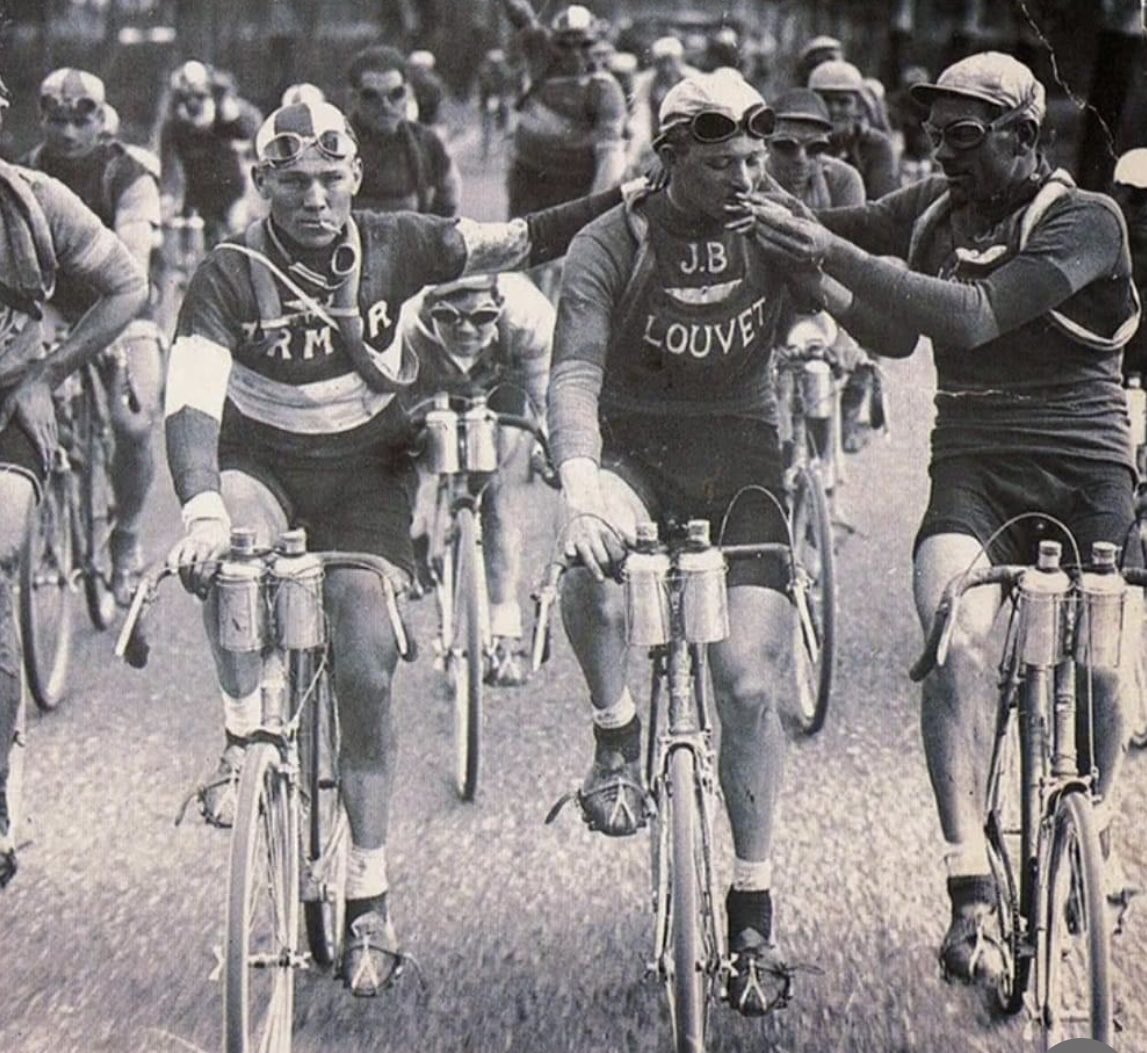 alicanayanlar's tweet photo. Sharing a cigarette during a leg of the Tour de France ~ 1920 https://t.co/Cs4ykCqCDK