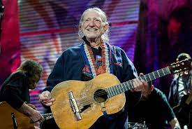 HistoryCodex's tweet photo. 🎶 An American Legend, Willie Nelson. 🌟 Singer. Songwriter. Legend. 🎸
🎶 Strumming Through History: The Willie Nelson Saga 🌟🎸 #CountryMusicIcon #OutlawCountryLegend #MusicMaverick #SongwriterExtraordinaire #StardustCrooner #FarmAidFounder #WillieNelsonStory
Amid the sun-soaked fields of Abbott, Texas, a young Willie Nelson carved out his destiny. Born into the heart of the Great Depression on April 29, 1933, he grew up in an era of struggle and resilience, a backdrop that would later infuse his music with a unique blend of empathy and grit.
As the years passed, Willie's fingers learned to dance on the frets of a guitar, and his voice matured into a rich, emotive instrument. His early life was a tapestry of experiences - he picked cotton, worked odd jobs, and even served in the Air Force for a brief period. But his heart was always in the music, and it wasn't long before he found his way to the neon lights of Nashville.
The 1960s marked his journey to Music City, where he sought his fortune as a songwriter. His compositions, like "Crazy" made famous by Patsy Cline, painted vivid emotions with words and melodies. Yet, Nashville's music establishment was a world of crisp suits and conventional sounds, a world that Willie was destined to challenge.
In the early '70s, as the counterculture movement swirled around him, Willie retreated to Austin, Texas. Here, he joined forces with fellow artists like Waylon Jennings and launched the outlaw country movement. With long hair, bandanas, and a worn guitar named Trigger, he stood as a symbol of rebellion, a champion for a genre that dared to break free from norms.
The album "Shotgun Willie," released in 1973, was a rallying cry, and the anthem "Whiskey River" became a mantra for those seeking authenticity in a world of artifice. But it was "Red Headed Stranger" that solidified his status as a country music visionary. This concept album, born from his imaginative storytelling, took listeners on a journey through heartache, revenge, and redemption.
The '70s and '80s were a whirlwind of creativity for Willie. Albums like "Stardust" showcased his versatility as he reimagined American standards, while his duets with Johnny Cash, Merle Haggard, and Julio Iglesias transcended genres, a testament to his universal appeal.
Beyond the music, Willie's life was woven with activism. In 1985, he co-founded Farm Aid, a benefit concert to support struggling farmers and address the challenges of agricultural life. His support for the cause showcased his commitment to using his influence for social good.
As the years pressed on, his music and influence continued to expand. His voice became synonymous with authenticity, a reflection of a life that had seen its share of triumphs and trials. And as he grew older, he remained an enigma, an artist who defied categorization, his music a bridge between generations and ideologies.
From the cotton fields of Abbott to the stage lights of the world's grandest arenas, Willie Nelson's journey was a symphony of passion, perseverance, and purpose. His legacy stands as a testament to the power of music to shape culture, inspire change, and touch the hearts of millions.