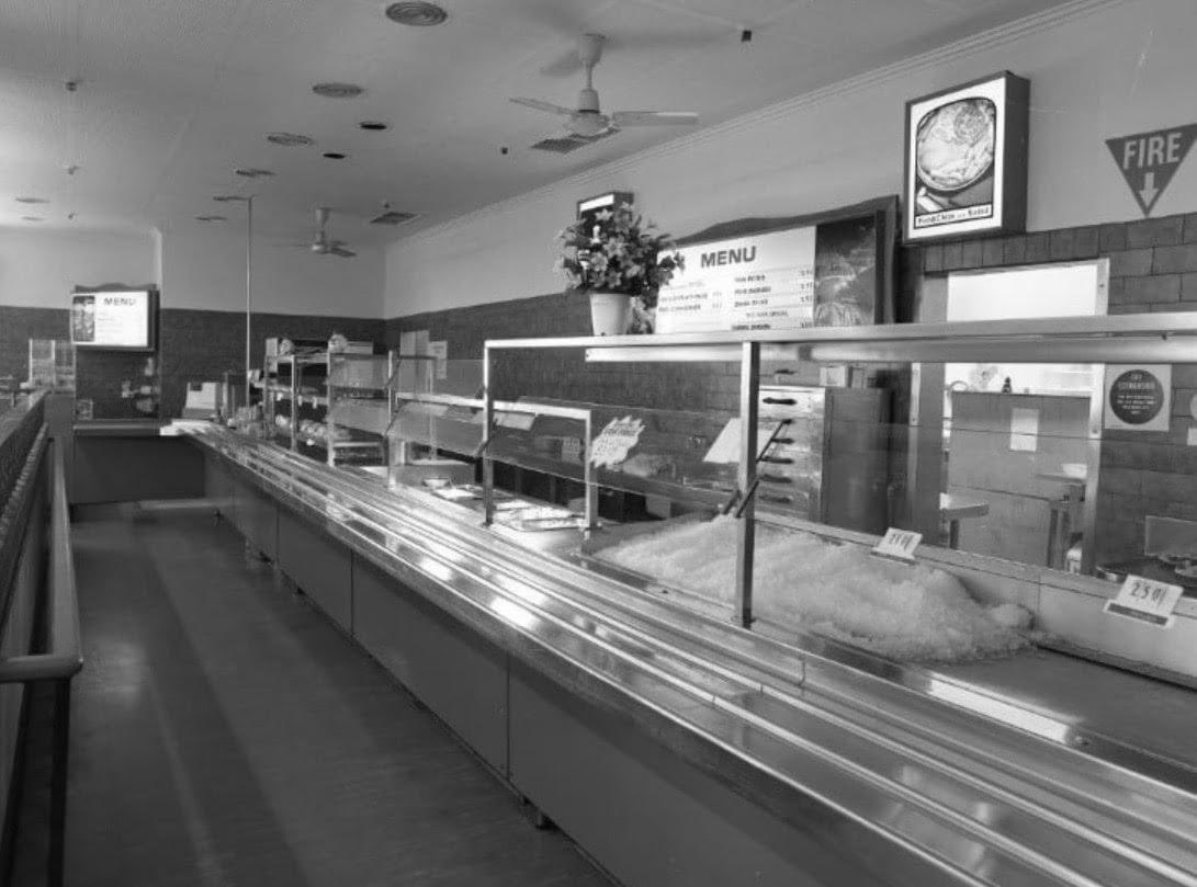 Trays + hot chips + gravy = Coles Variety Cafeteria. This is the Launceston Coles Cafeteria, photographed in the 1990s before it closed.

The building still stands, at the western end of the mall. 

Collection of QVMAG, Launceston.