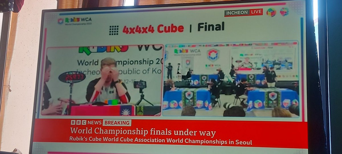 Pacman_Ownage's tweet photo. How is this not a fake screenshot? On BBC News live... right now is the Rubiks cube world championship. There are Two commentators... VIP front row seats ... what? Who is this for? 😂😂 https://t.co/Pa0PycpqRk
