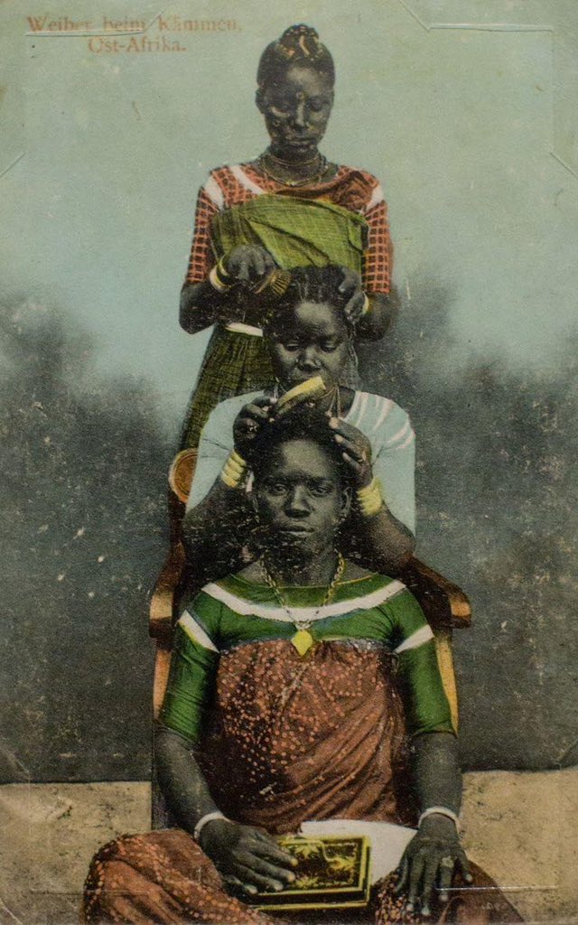 African women meticulously weave stories into each strand as they deftly plait hair, creating intricate patterns that celebrate culture, creativity, and heritage. The rhythmic dance of their hands echoes the unity of generations, intertwining tradition and artistry in every