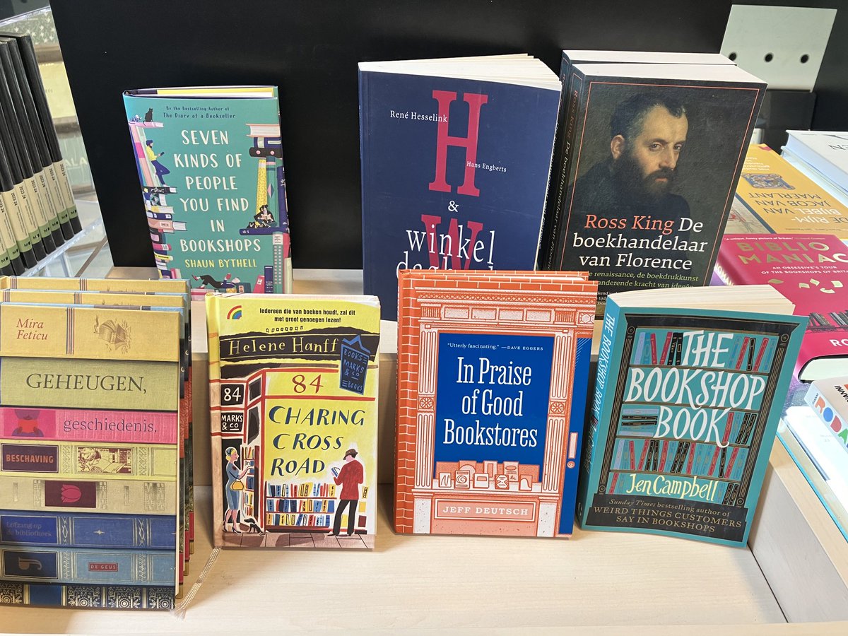 Multilingual bookshop with a display of books on bookshops💕 Passa porta in Bruxelles