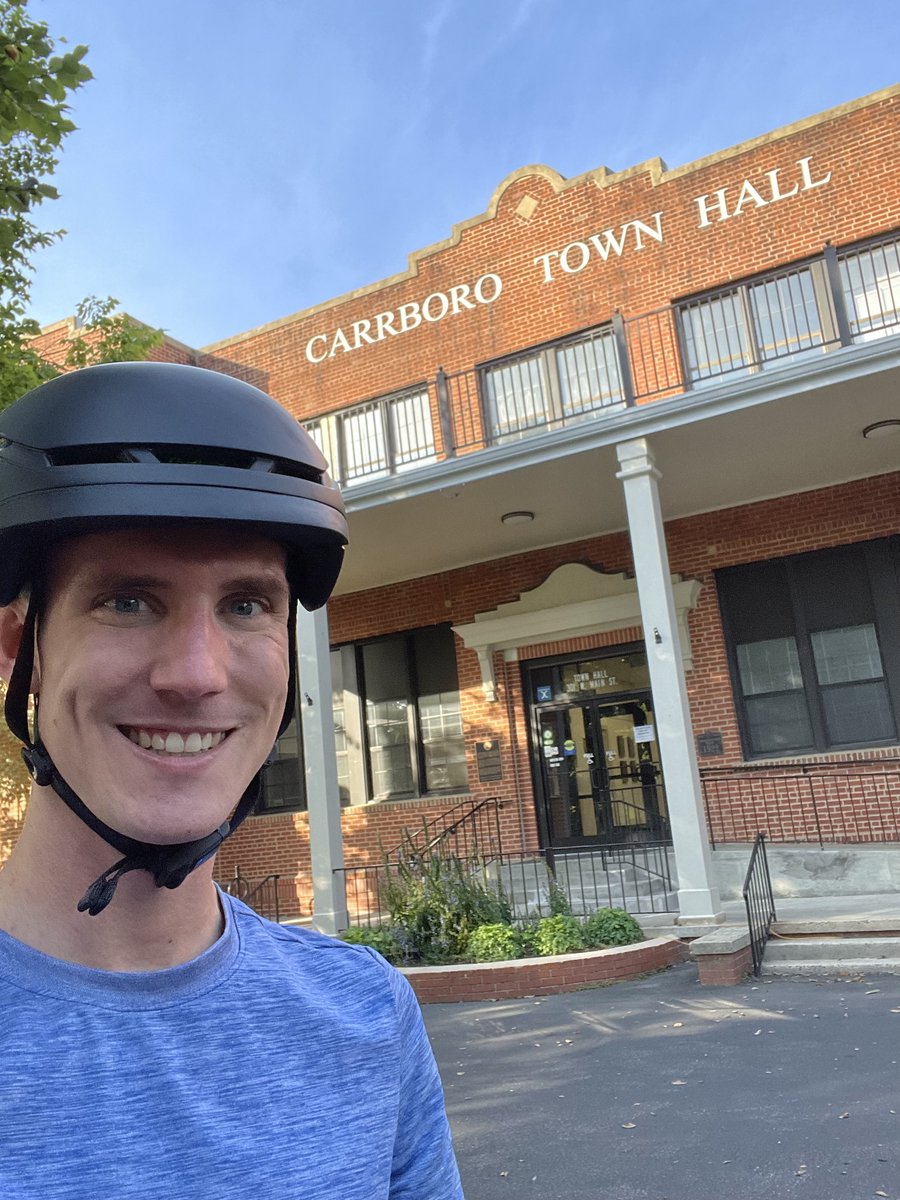 Grad student biking to school for @CarrboroGov ’s #CityHallSelfie Day! Looking forward to seeing more people-friendly infrastructure, more affordable dense housing and more greenways!
