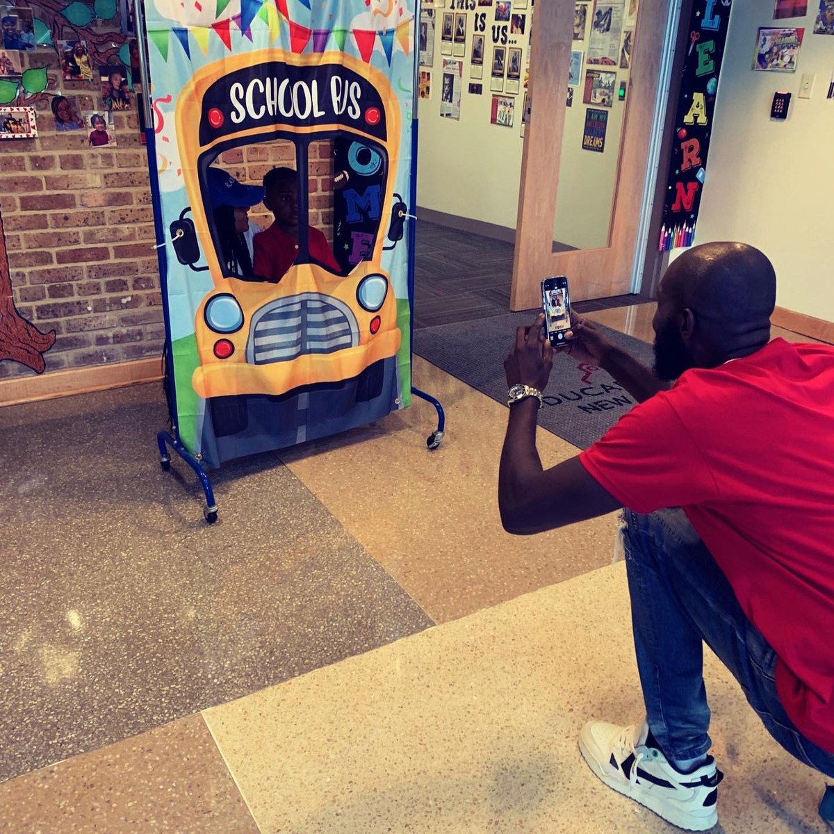 EducareNOLA's tweet photo. A team of @educarenola Dads rolled out the welcome carpet for children and families this morning!  Perfect start to another great day!  #educarenola #educaredads #neworleans #familyengagement https://t.co/xlWS1qbe5y