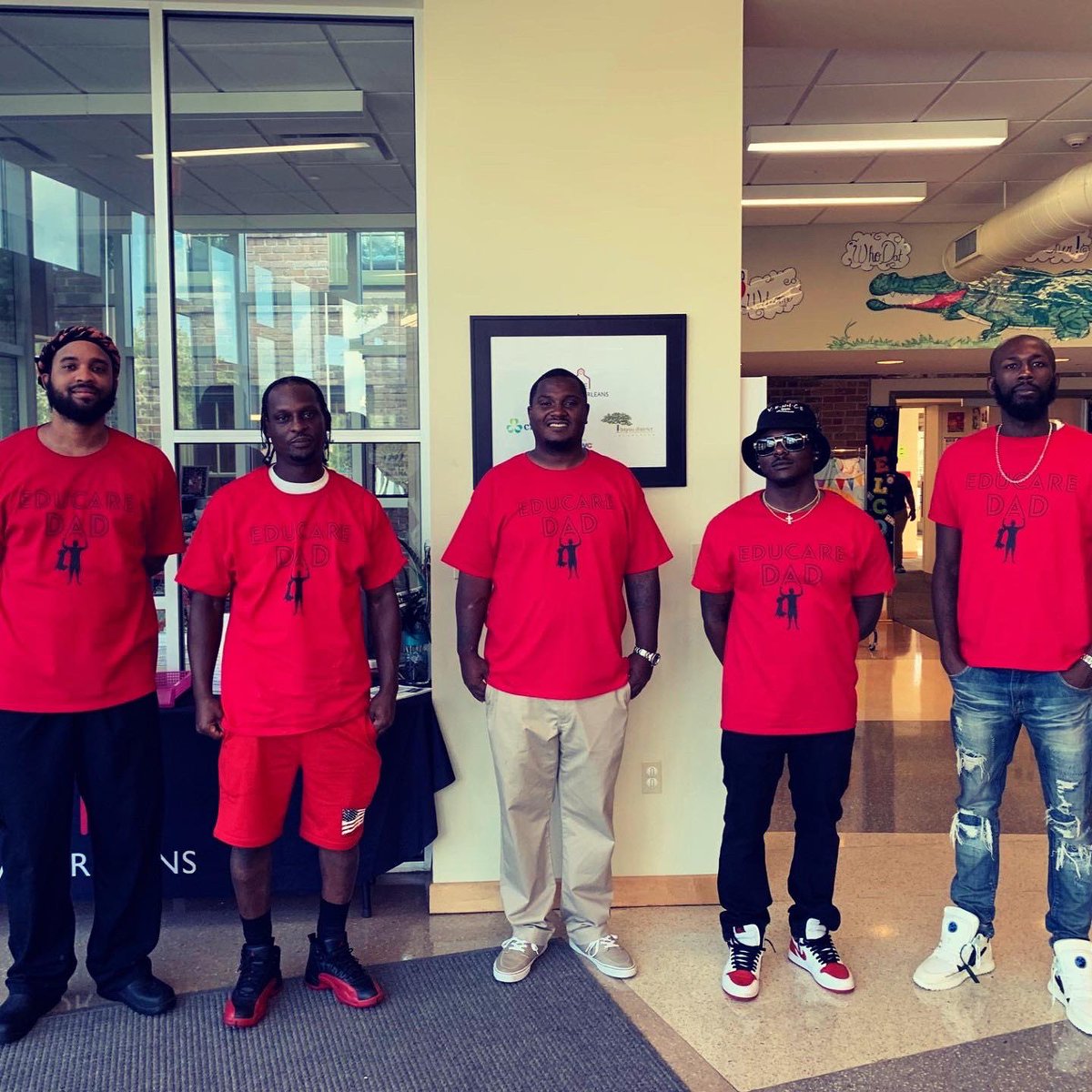 EducareNOLA's tweet photo. A team of @educarenola Dads rolled out the welcome carpet for children and families this morning!  Perfect start to another great day!  #educarenola #educaredads #neworleans #familyengagement https://t.co/xlWS1qbe5y