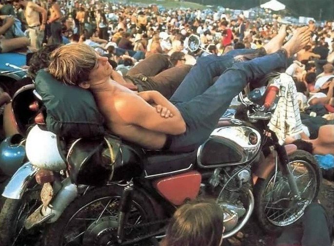 ZmmQuality's tweet photo. A young man rests on his #Honda #CB77 #Superhawk #motorcycle #otd August 15, 1969 at the #Woodstock #Music Festival... 3 Days of Peace, Love &amp; Music. #motorcyclelife https://t.co/yI6sXrkdmT