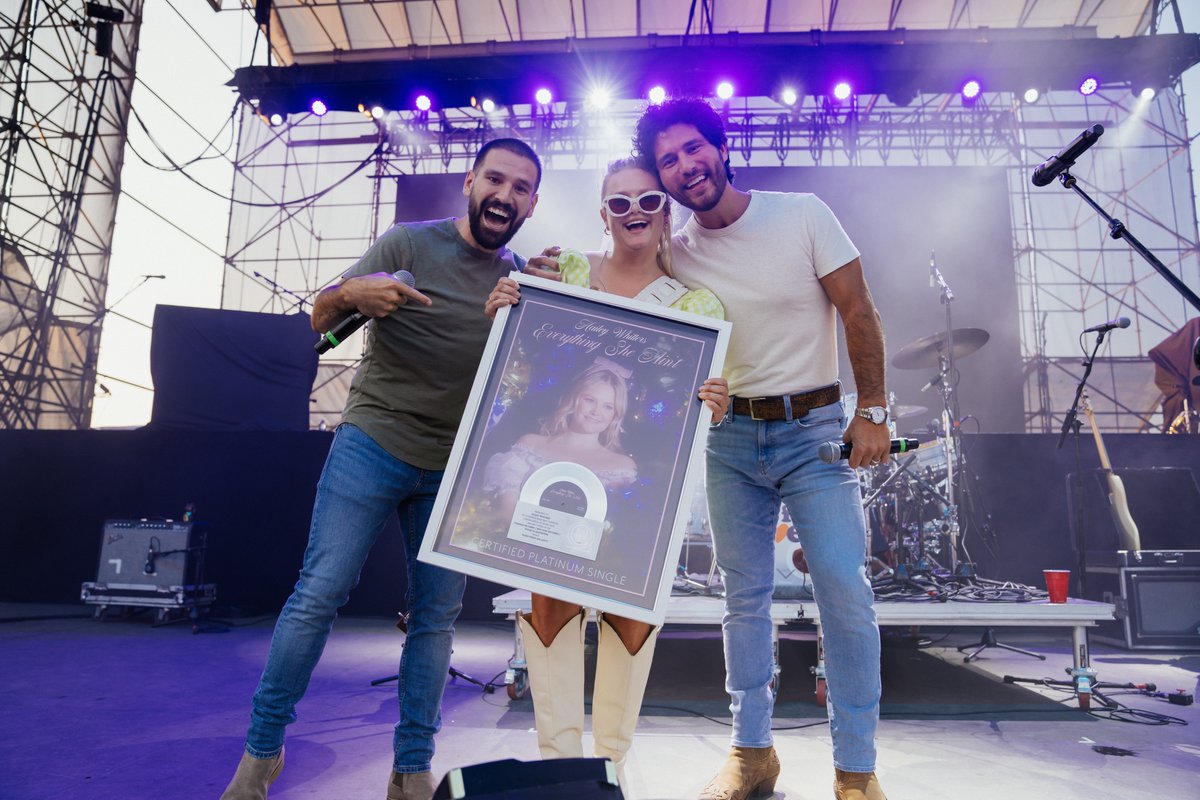 RIAA's tweet photo. 🎉 With @danandshay delivering an unforgettable onstage surprise, @haileywhitters celebrates her FIRST Platinum single for #EverythingSheAint💿! Cheers to the @BigLoud team 👏 https://t.co/eHDpzxZbD8