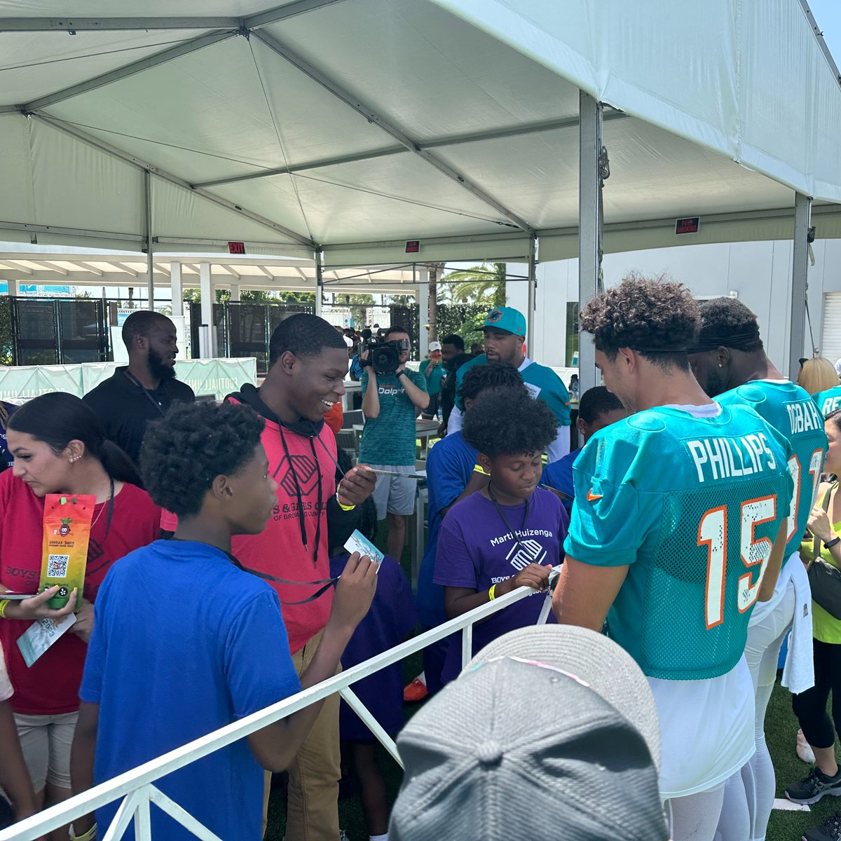 FinsOffTheField's tweet photo. @ChubbFoundation hosted special guest from
@BGCofBroward in the #FootballUNITES Community
Corner during practice yesterday! Thanks to @reggaebeets for providing our kids with a delicious meal.😋

Post-practice @astronaut brought some friends to visit for autographs.🏈🐬 https://t.co/1hOVb5DBoq