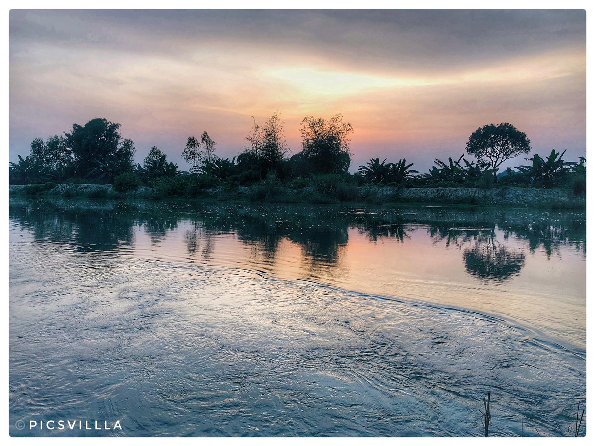 Nature’s canvas painted with hues of serenity 🌅🌊🌳 #SunsetMagic #RiverFlow #Nature 
#photography #GenshinImpact #iPhone #Scenery #wednesdaythought