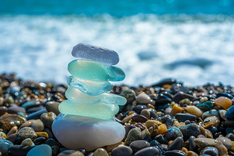 Sea glass are naturally weathered pieces of glass, which often have the appearance of tumbled stones. "Sea glass" is physically and chemically weathered glass found on beaches along bodies of salt water. These weathering processes produce natural frosted glass.
