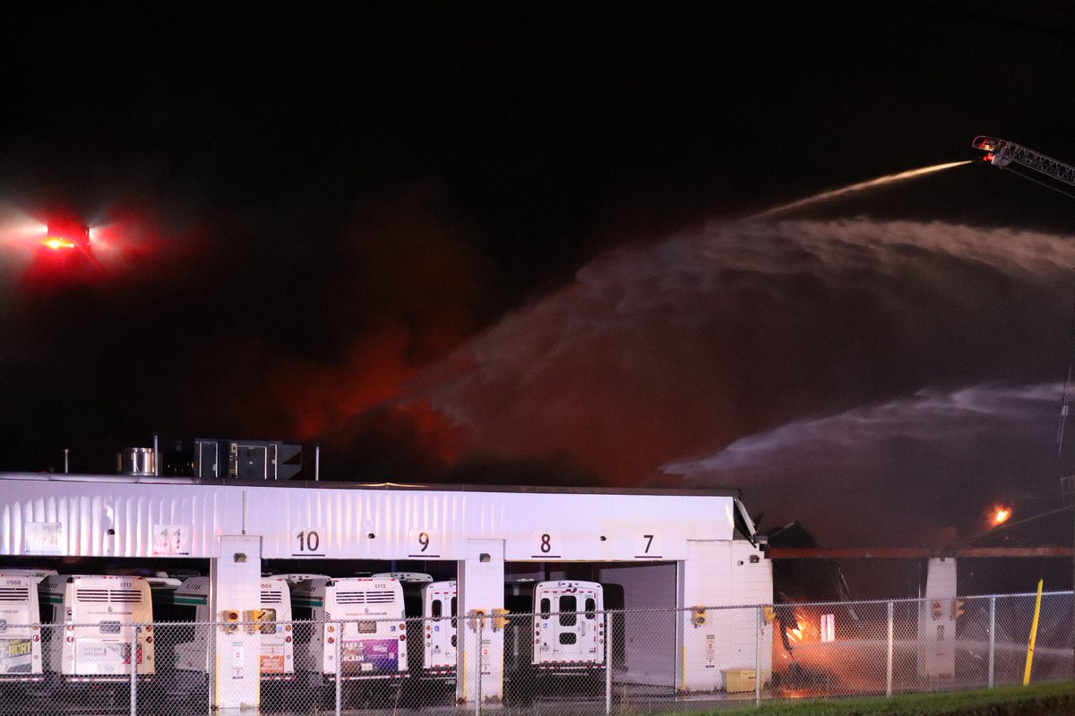 DurhamResponses's tweet photo. Crews continue to fight the 3rd alarm fire at the DRT “Raleigh Garage” in South Oshawa. 

Defensive operation, both aerial devices being utilized, deck guns + numerous lines in operation. 

Several busses in facility, total roof collapse into structure.

@OshawaFire @iafflocal465 https://t.co/ruR61CF0Zx